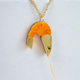 A whimsical gold Shrimp Pendant Necklace featuring a realistic orange and beige shrimp, displayed against a plain white background for a playful touch.